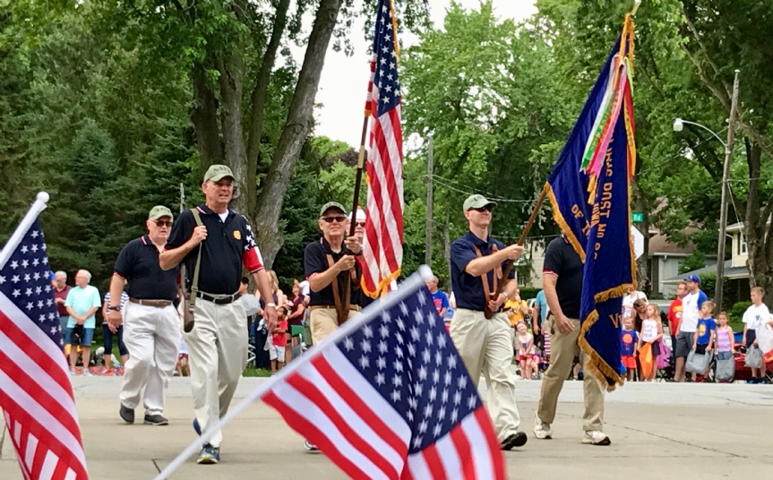 Post 8879 Carries the Colors to start the parade.
